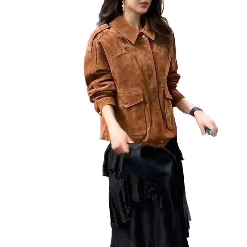 Women's brown suede coat with regular sleeves on a hanger.