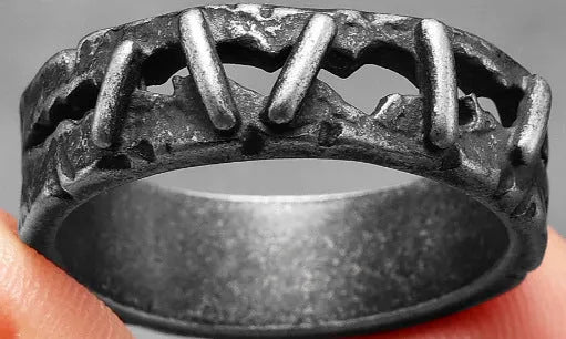 Stainless steel double ring with punk stitching style details in dark colour.