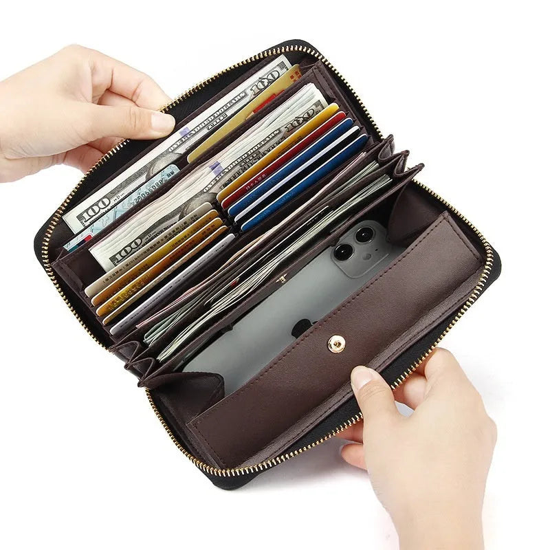 Women's long genuine leather wallet in black showing card compartments and anti-theft swiping feature