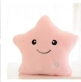 Colourful glowing five-pointed star plush pillow on a dark background, showcasing its soft texture and luminous light.