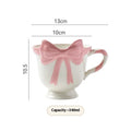 Ceramic mug with girl heart bow design in black pink or white powder colours, 301-400ml capacity