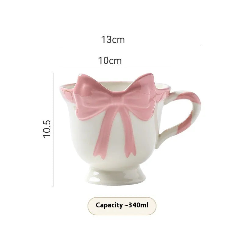 Ceramic mug with girl heart bow design in black pink or white powder colours, 301-400ml capacity