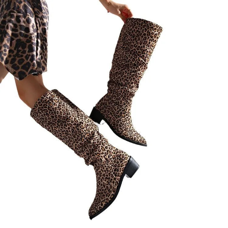 Brown women's leopard print ankle boots with a square toe and chunky mid-heel on a plain background.