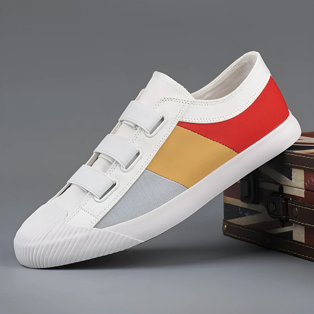 Men's low-top canvas sneaker with elastic band, round toe, and vulcanised rubber sole in beige colour.