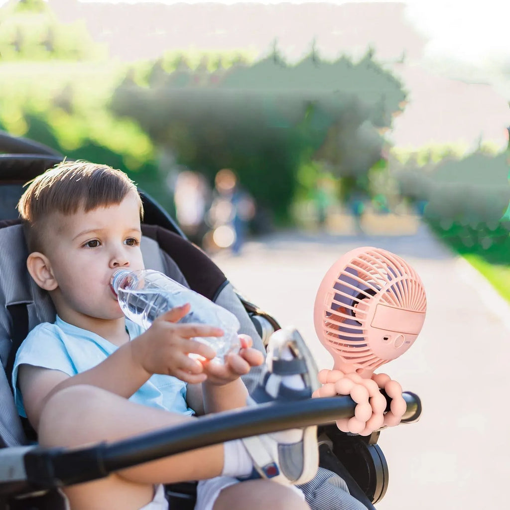 Pink USB rechargeable octopus stroller fan with flexible legs attached to a baby pushchair