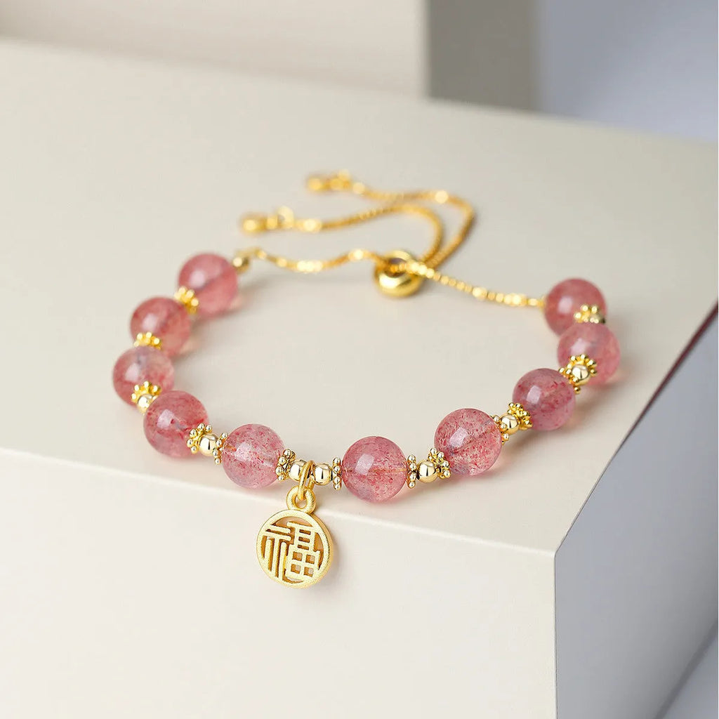 Pink strawberry quartz geometric bracelet with electroplated finish and fu character detail
