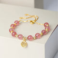 Pink strawberry quartz geometric bracelet with electroplated finish and fu character detail