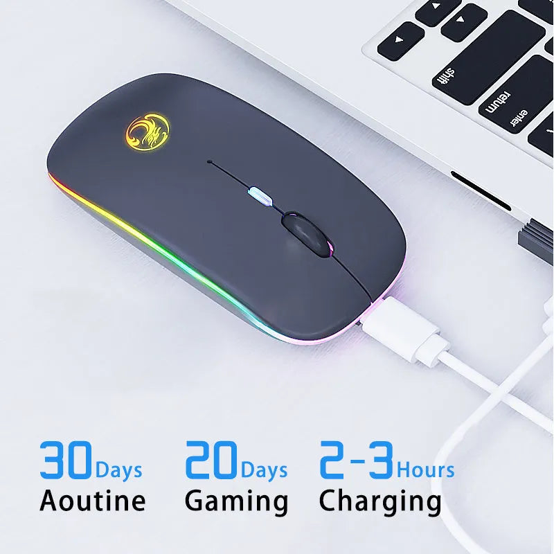 Black and white dual-mode wireless silent mouse with luminous charging scroll wheel on a desk.