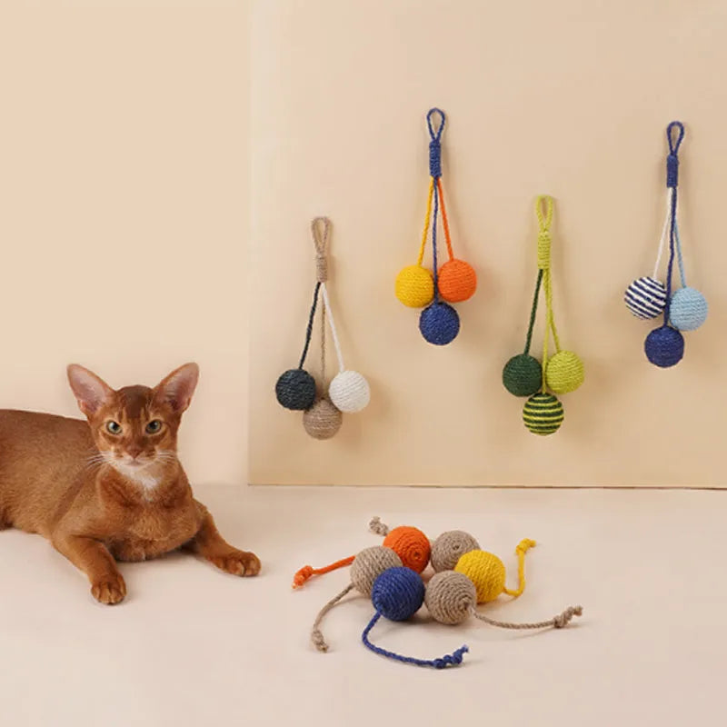 Four-piece cat toy set featuring a teaser stick and a catnip ball on a blue background