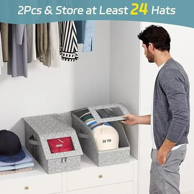 Grey foldable fabric storage box with cover, shown next to a baseball cap.
