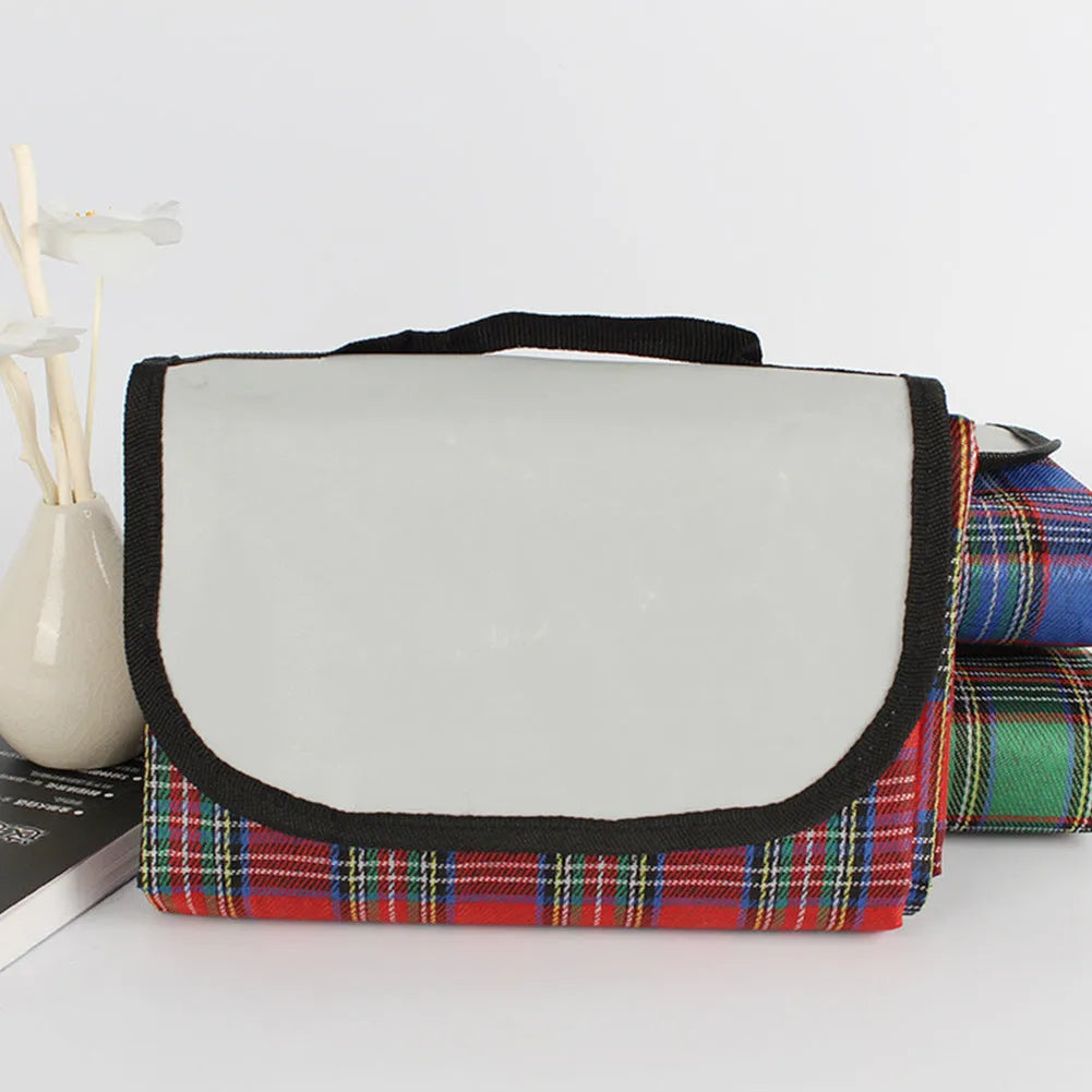 Waterproof acrylic picnic mat in green, red, or blue plaid, 150 x 100cm, with one cushion