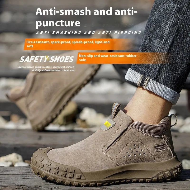 Mid-calf grey steel-toe safety work boots for welding and construction on a industrial floor.