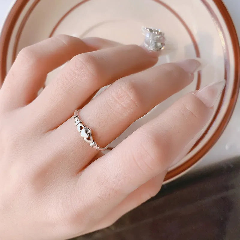 Retro silver copper open ring for women featuring a detailed heart shape design on an adjustable band.