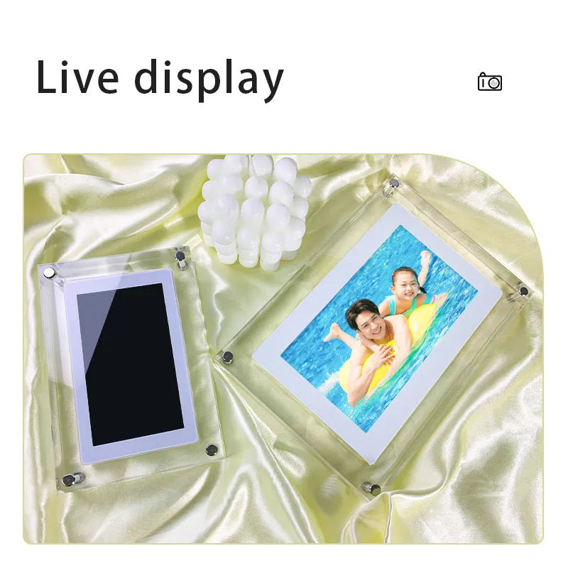 White vertical digital photo frame with 5-inch screen showing family photographs