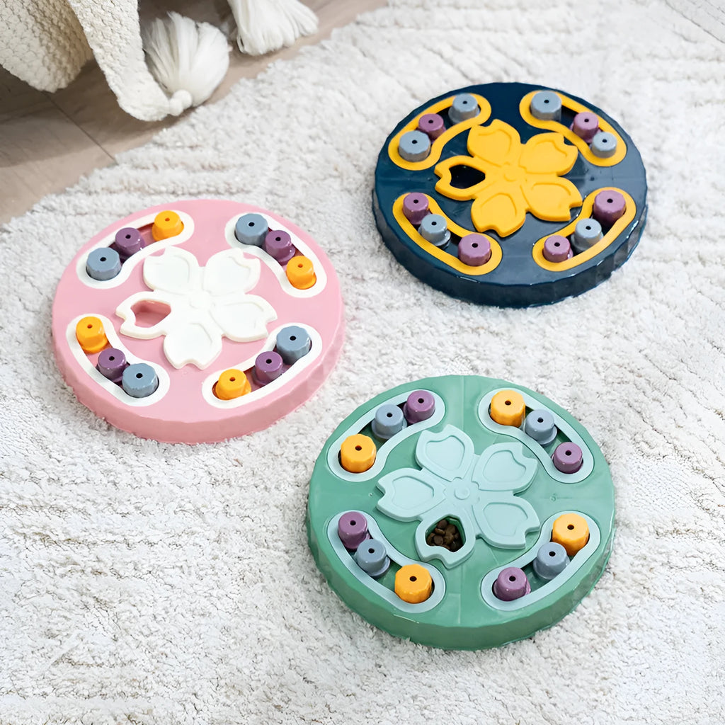 Blue interactive slow feeder dog bowl with puzzle channels, 28 cm diameter, on a wooden floor.