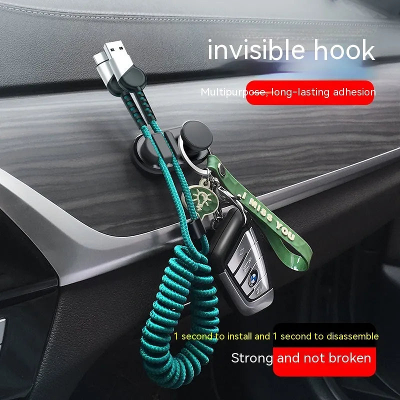 ABS silicone adhesive hook for car data cable storage in dark green, silver, or black.