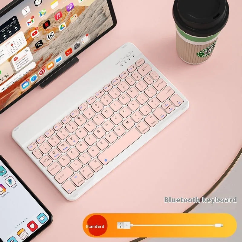 Bluetooth keyboard and rechargeable mouse set for tablet in elegant white on a desk