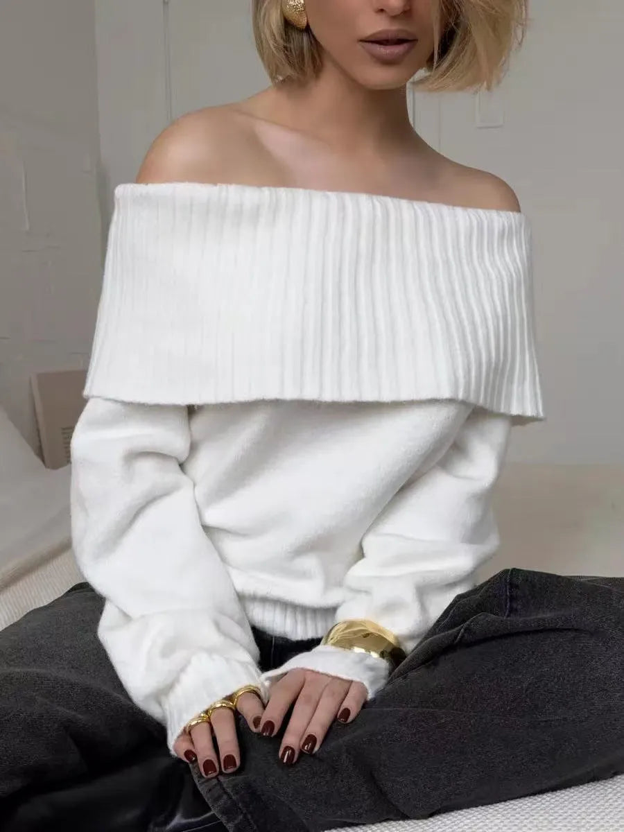 Grey off-the-shoulder sweater with a 3D textured pattern and regular sleeves on a model.