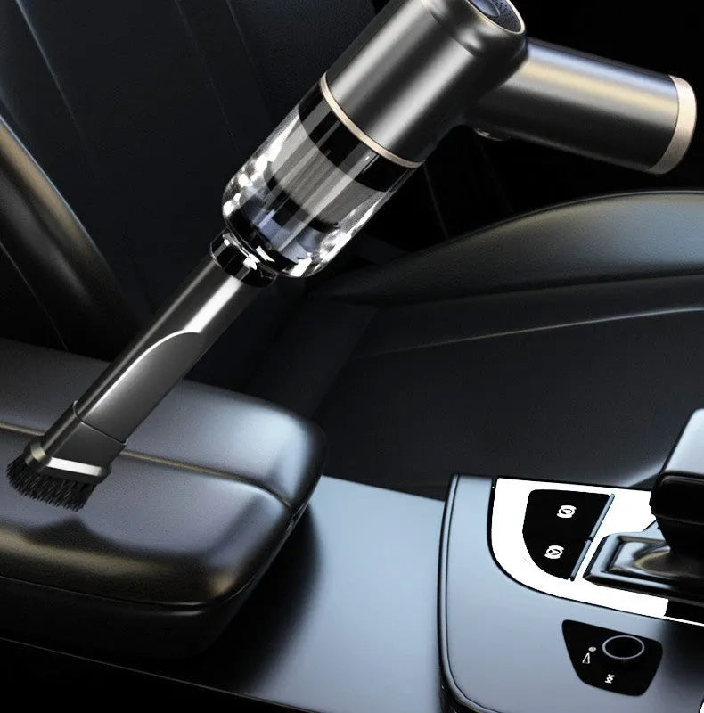 Black wireless handheld car vacuum cleaner with attachments including brushes and nozzles.