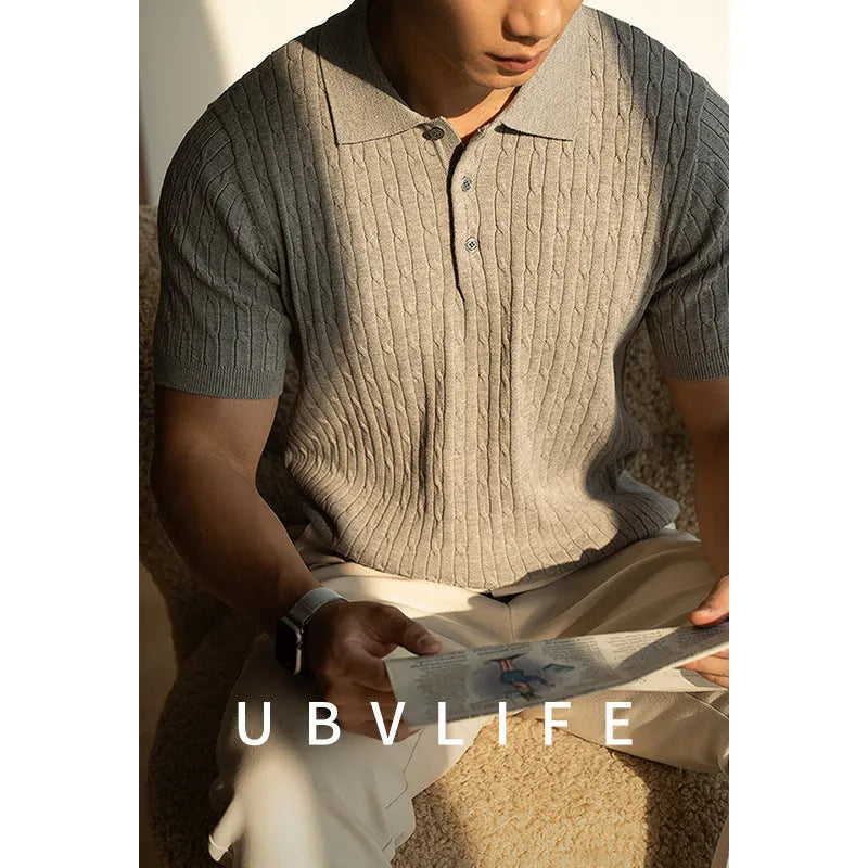 Men's khaki short sleeve business casual top on a hanger