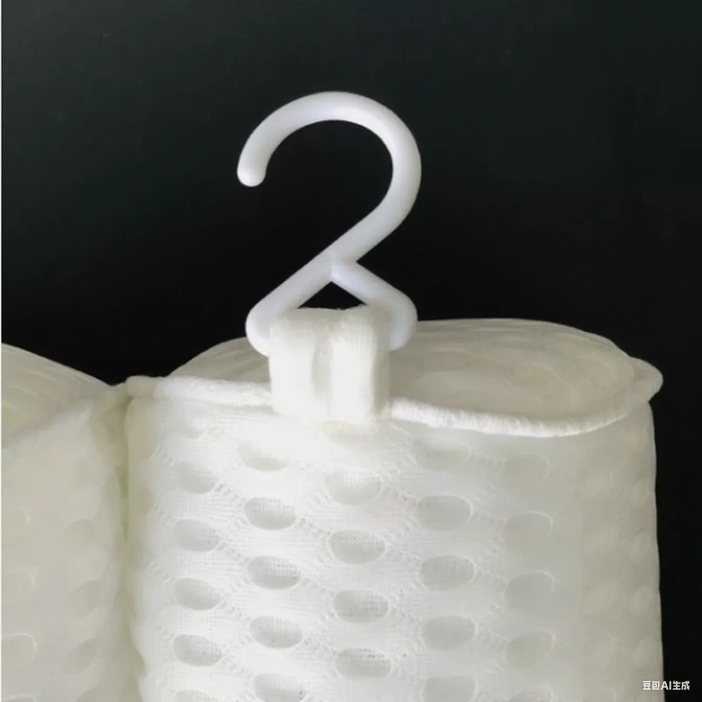 White 4D mesh bathtub pillow with suction cups on a bathtub