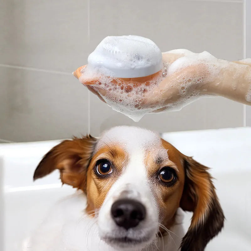 Orange TPR dog bath brush with shampoo dispenser and pumpkin-shaped grip for pet grooming