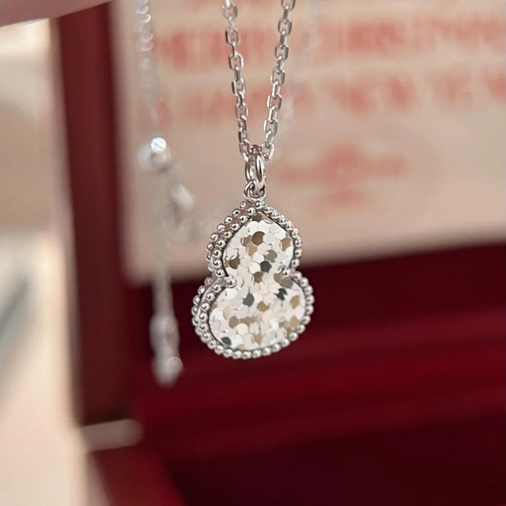 Gourd double-sided clavicle chain necklace in gold and silver options on display