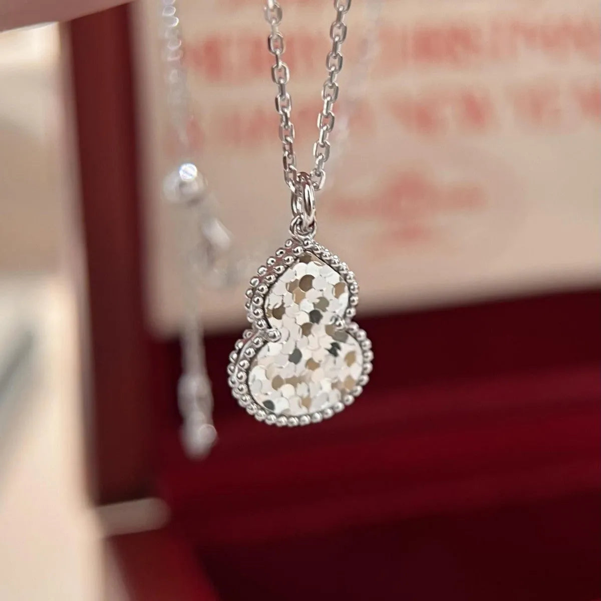 Gourd double-sided clavicle chain necklace in gold and silver options on display