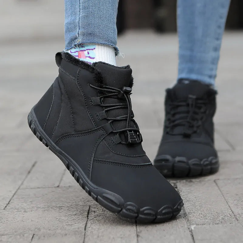 Black waterproof snow boots with fleece lining and a lace-up front on a rubber sole.