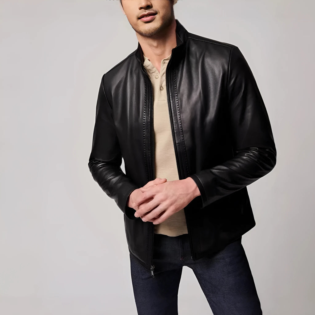 Man wearing a black retro-style leather-look jacket made from polyester fibre.