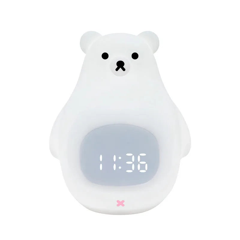 White silicone cartoon bear-shaped night light with remote control on a bedside table.