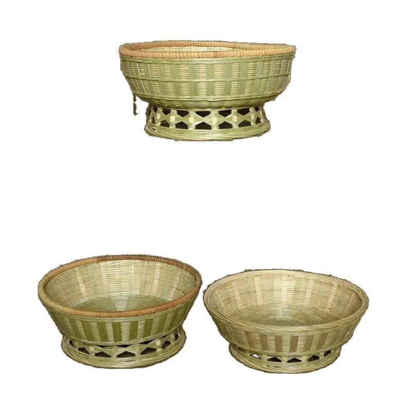 Handmade natural bamboo woven storage basket on a wooden surface.