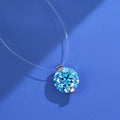 Close-up of a women's sterling silver necklace with a floating moissanite pendant and plum blossom detail.