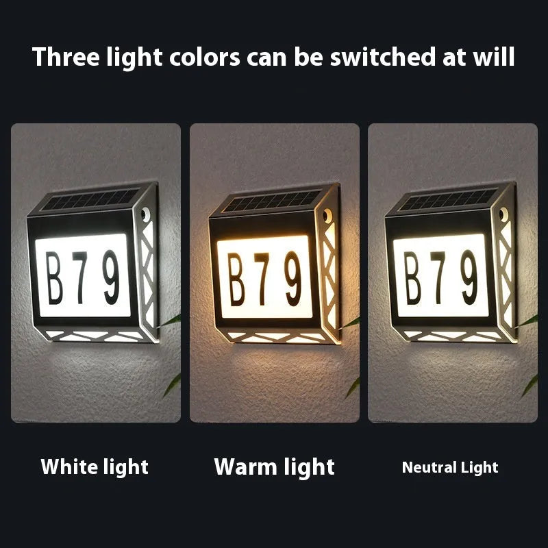 Black solar powered doorplate light with digital LED display showing house numbers