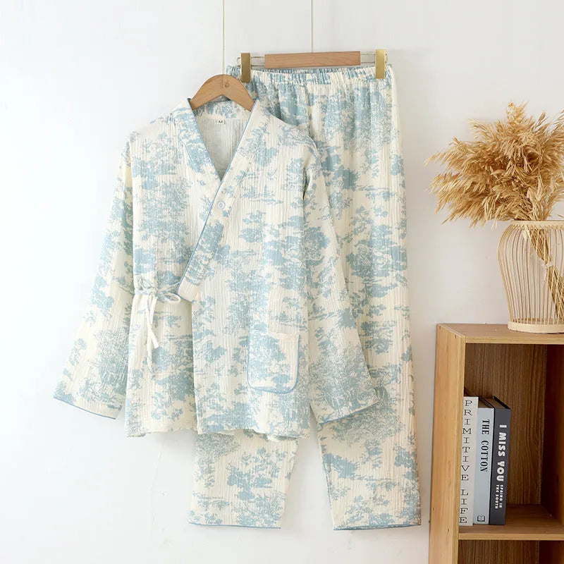 Women's pink cotton gauze lounge suit set with long sleeves and trousers laid flat.