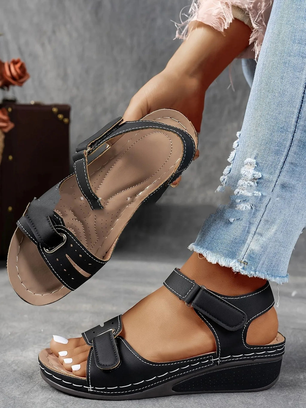Beige wide fit sandals with thick composite sole and adjustable Velcro straps on a white background.