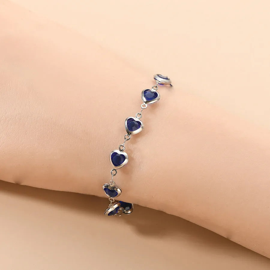 Stainless steel geometric Devil's Eye bracelet shown in one of six colour options: colourful, blue, green, red, light green, or light blue.