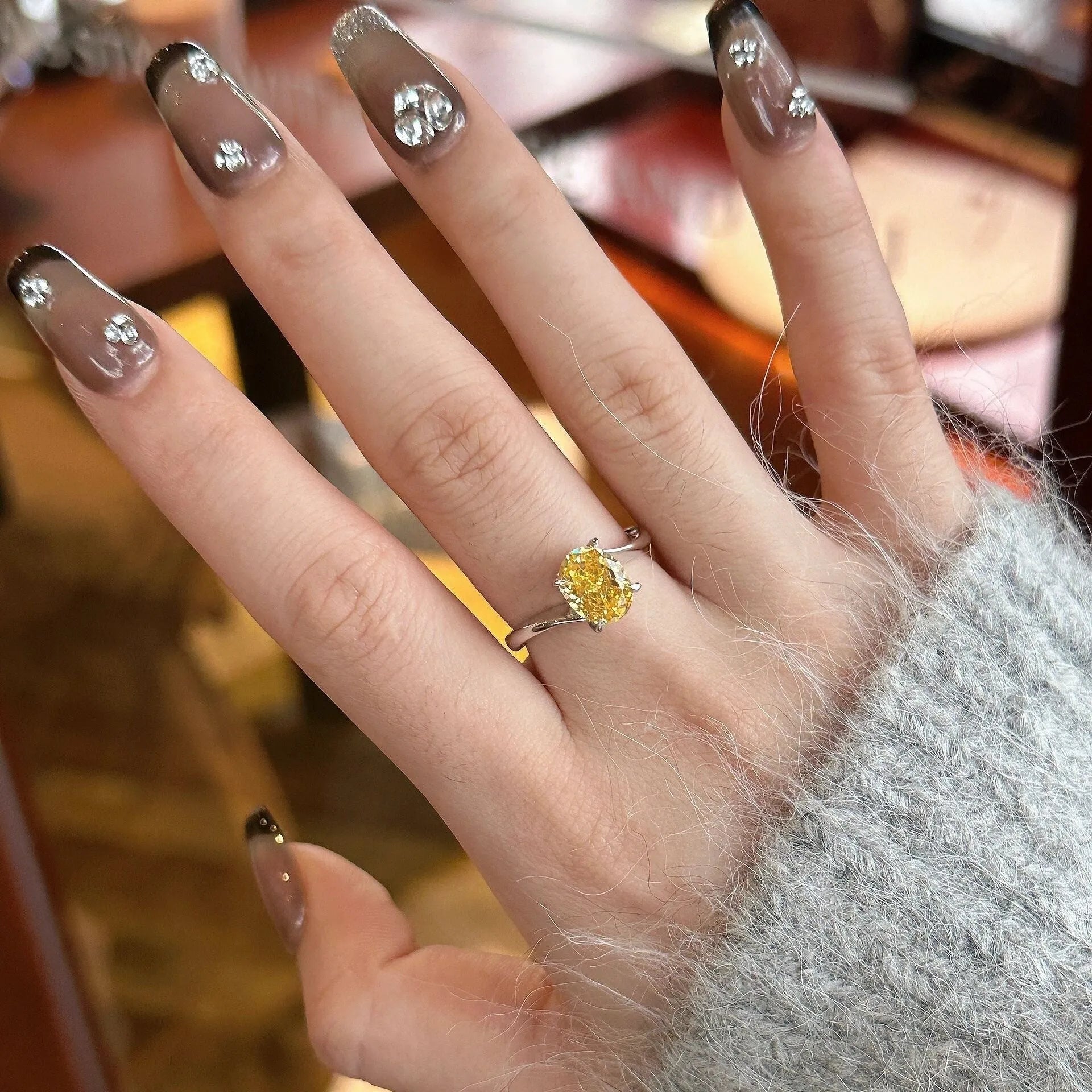 Women's yellow rock sugar crystal ring on copper band showing detail of crystal design