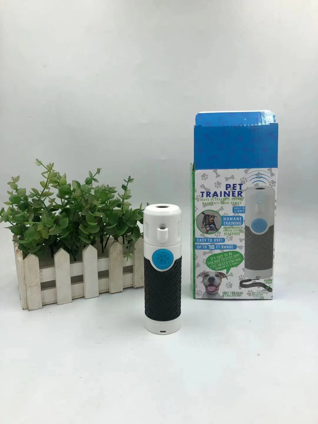 White handheld ultrasonic dog bark control trainer with ABS plastic housing