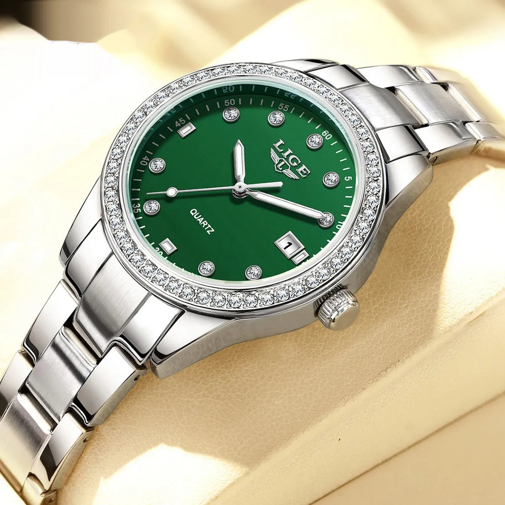 Women's silver stainless steel watch with diamond bezel and luminous hands on a 34mm round dial.