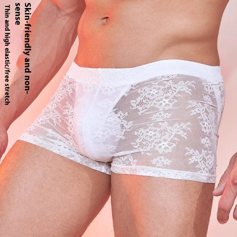 Men's black lace trim boxers made from nylon fabric, laid flat.