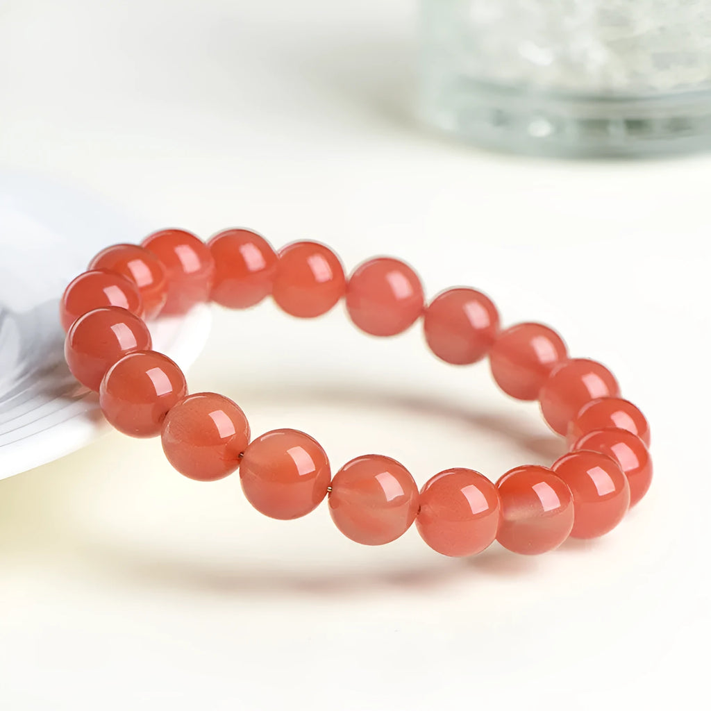 Natural cherry red agate scattered bead bracelet with polished stones, shown in various size options.