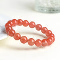 Natural cherry red agate scattered bead bracelet with polished stones, shown in various size options.