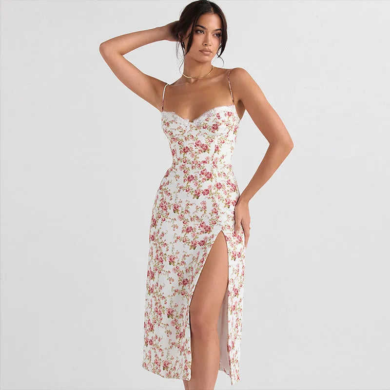 Women's blue lace flowers print long dress with suspender straps and a side slit on a model.