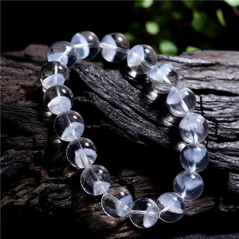 Women's white crystal bracelet with natural ghost pyramid shapes and Ruyi design elements