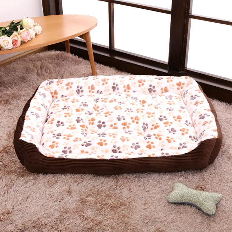 Beige plush dog bed with raised edges and removable cushion for small pets