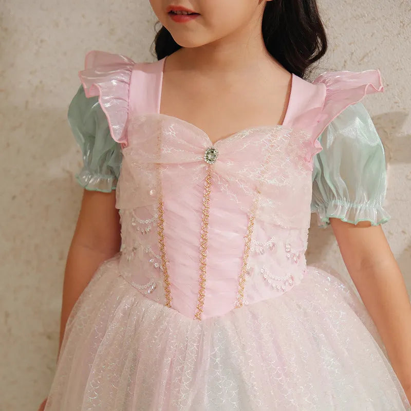 Little girl wearing a puff sleeve mermaid princess dress in cotton fabric, solid colour style, suitable for party or wedding