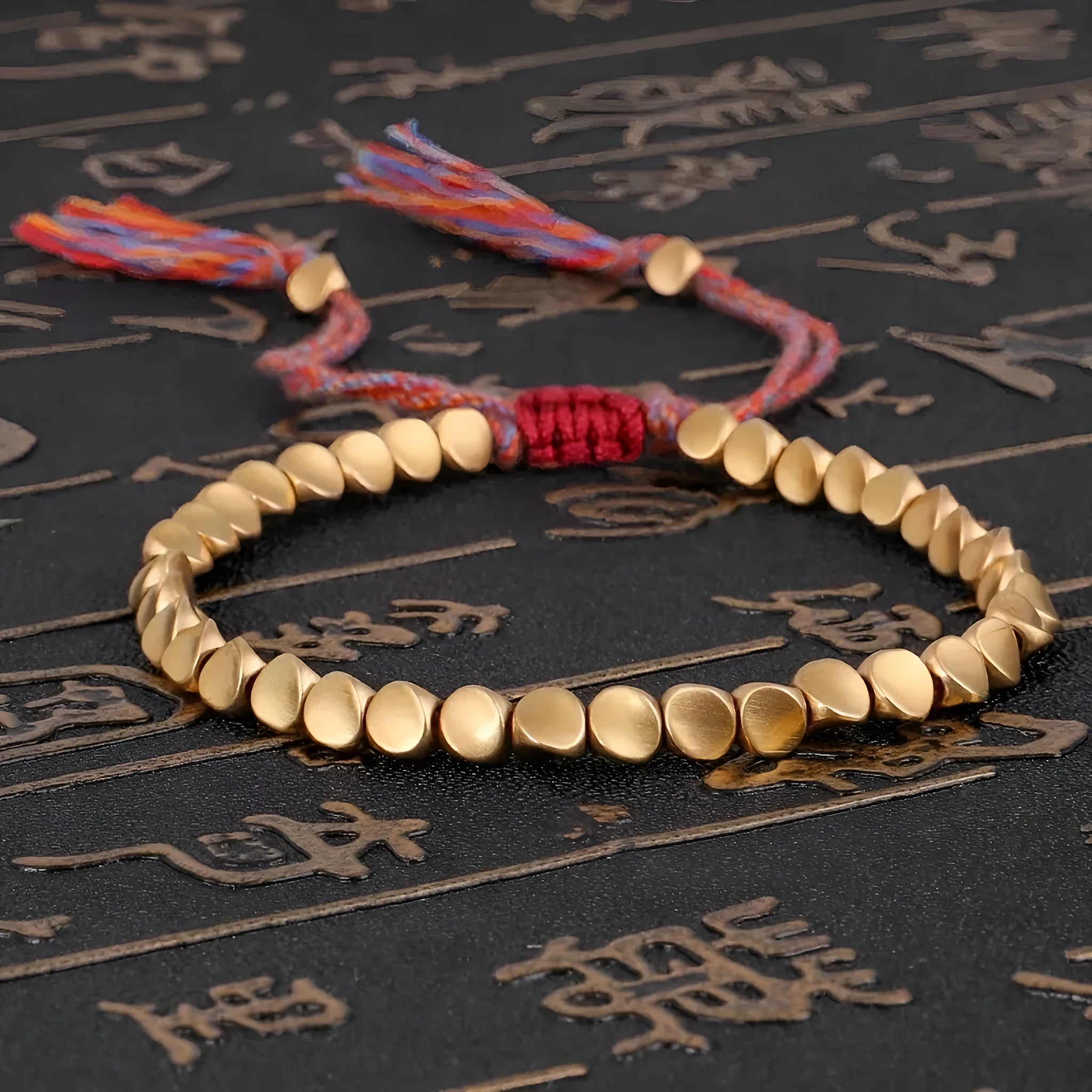 Hand-woven adjustable alloy tassel bracelet in electroplated colour T131 on neutral background
