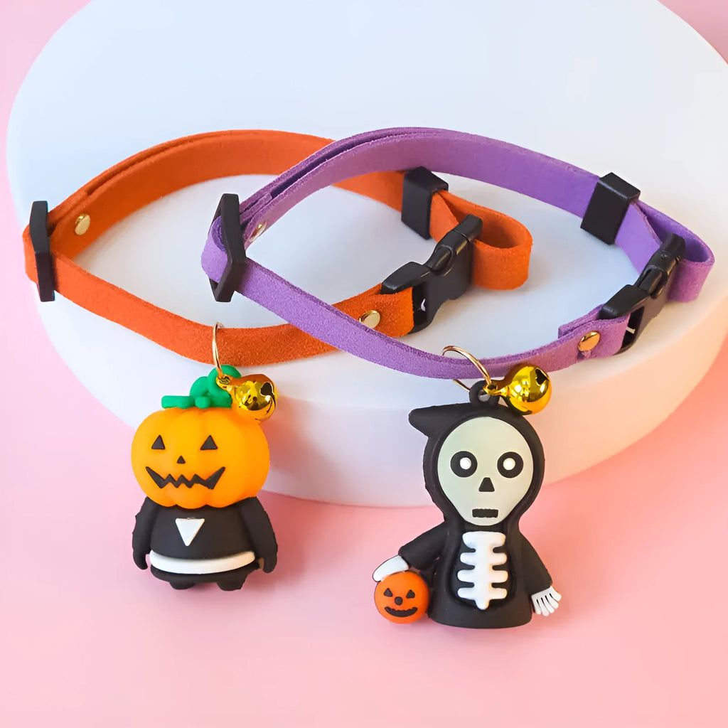 Halloween pet collar with cartoon pumpkin and skull patterns in glow-in-the-dark material, shown in multiple sizes.