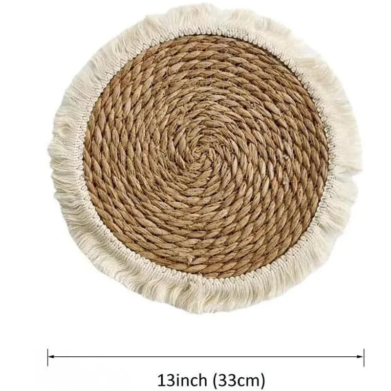 Round Japanese straw placemat with tassel edge in natural papyrus material on wooden dining table